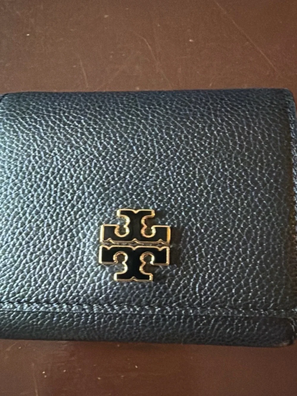 Tory Burch Britten Compact Wallet in black pebbled leather. - Picture 1 of 13